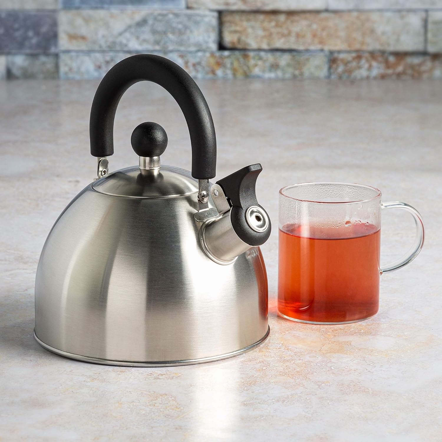 Stovetop Whistling Kettle — Features a rapid-boil whistling spout and a heat-resistant folding handle.